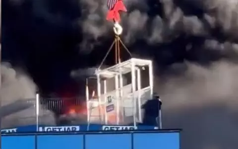 England: A crane operator rescued a man trapped on the roof of a burning building