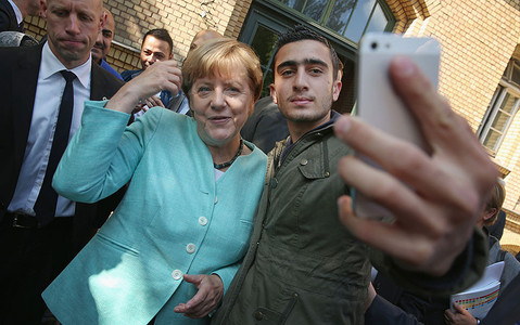 Angela Merkel pushes Tunisia PM to speed up migrant returns