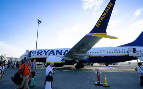 Ryanair cuts profit forecast after online travel agent row