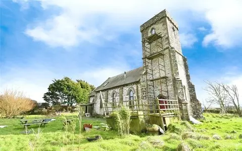 Converted church on sale for just £5k more than parking space in London