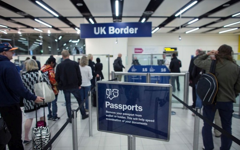 Net migration to UK fell 10% last year, ONS says