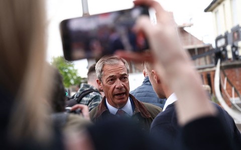 Objects thrown at Nigel Farage on open-top bus