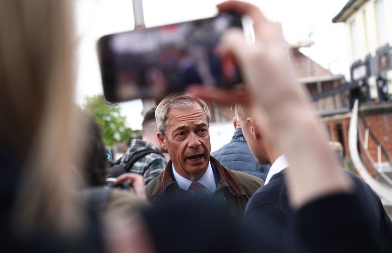 Objects thrown at Nigel Farage on open-top bus