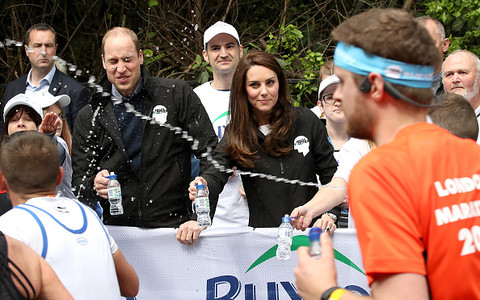 Prince William and Duchess of Cambridge splashed with water by London Marathon runner