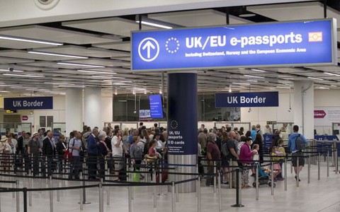 EU citizens applying to stay permanently in UK will be left in limbo for a decade, warns report