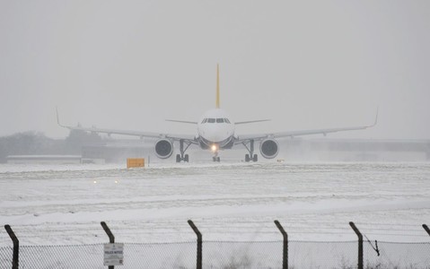 Flights and trains cancelled as snow hits UK