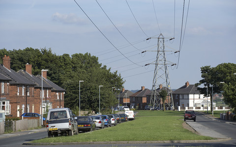 People living near new pylons in Great Britain could get £250 a year off energy bills