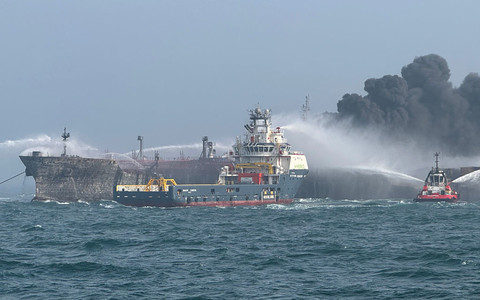 Fire continues after collision between tanker and container ship in North Sea