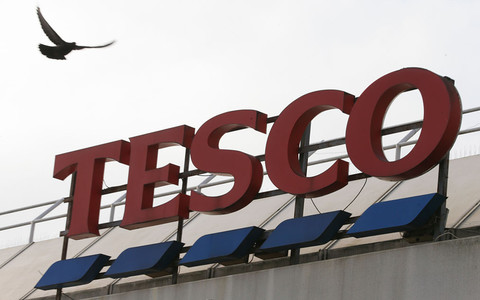 Tesco shares fall despite dividends being restored