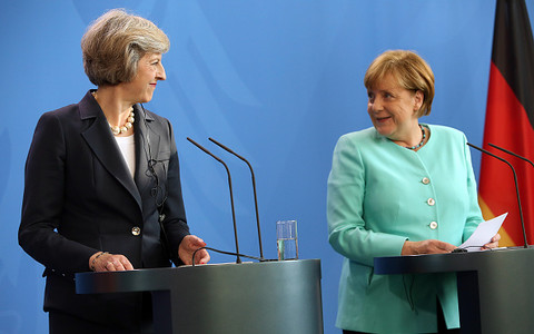May, Merkel re-voice commitment to Iran N-deal