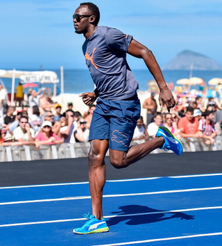 Usain Bolt won a 100-meter race on a Rio de Janeiro beach with a time of 10.06 seconds on Sunday