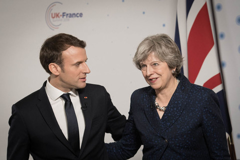 Theresa May and Emmanuel Macron hold talks on migrants and defence
