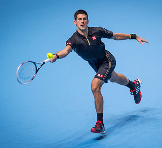 Novak Djokovic crushes Stan Wawrinka to stay on top of group and world