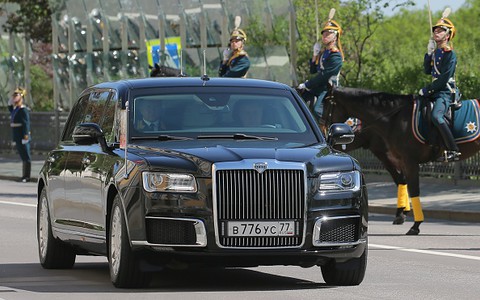 Russian President Vladimir Putin rides in his new limousine