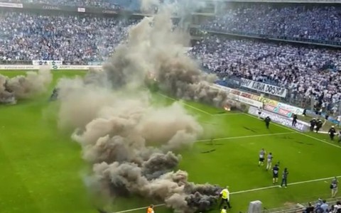 Lech Poznan clash abandoned as crowd turn stadium into 'war zone'