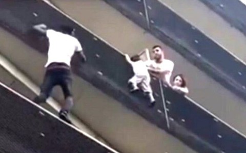 Mamoudou Gassam who climbed building in Paris to save child on balcony is declared a hero